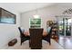 Cozy dining area with a round table, four chairs, and natural light from a window at 5754 Sweet William Ter, Land O Lakes, FL 34639