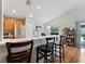 Bright kitchen featuring a breakfast bar, stainless steel appliances, and a view of the backyard at 5754 Sweet William Ter, Land O Lakes, FL 34639