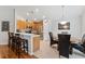 Well-lit eat-in kitchen featuring a breakfast bar, stainless steel appliances, and ample counter space at 5754 Sweet William Ter, Land O Lakes, FL 34639