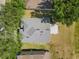 Aerial view showcasing a well-maintained roof, driveway, and landscaping at 5754 Sweet William Ter, Land O Lakes, FL 34639