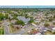 Aerial view of neighborhood with lakes and mature trees at 1023 Springtime Dr, Holiday, FL 34691