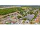 Enjoy serene water views from this home's lakeside location as seen from this aerial showcasing the surrounding neighborhood at 1023 Springtime Dr, Holiday, FL 34691