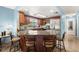 Charming kitchen with granite countertops, stainless steel appliances, and convenient breakfast bar seating at 1023 Springtime Dr, Holiday, FL 34691