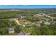 Aerial view showcasing the home's location amid green spaces and a serene neighborhood at 10262 Maybird Ave, Weeki Wachee, FL 34613