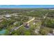 Aerial image showing home nestled in a wooded neighborhood with lush greenery at 10262 Maybird Ave, Weeki Wachee, FL 34613