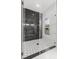 Modern walk-in shower featuring rainfall shower head and decorative tile at 10262 Maybird Ave, Weeki Wachee, FL 34613