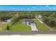 New home featuring a manicured lawn and charming walkway to the front door at 10262 Maybird Ave, Weeki Wachee, FL 34613