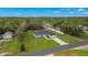Exterior aerial of the home with a big yard, a garage and a long driveway at 10262 Maybird Ave, Weeki Wachee, FL 34613