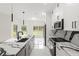 A stylish kitchen featuring an island with marble countertops and stainless steel appliances at 10262 Maybird Ave, Weeki Wachee, FL 34613