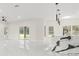 Open-concept with a sleek island, pendant lighting, and sliding doors to the outside at 10262 Maybird Ave, Weeki Wachee, FL 34613