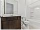 Bathroom featuring dark wood vanity with quartz countertop, tub and shower at 11423 Shoreline Trl, Parrish, FL 34219