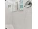 Modern shower features white tile, glass partition and chrome fixtures at 11423 Shoreline Trl, Parrish, FL 34219