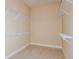 Spacious walk-in closet with ample shelving and organizational space, providing plenty of room for storage at 11423 Shoreline Trl, Parrish, FL 34219