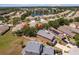 Wide aerial shot of house and neighboring houses, highlighting proximity to local lake at 11449 Crestlake Village Dr, Riverview, FL 33569
