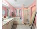 Bathroom features a double vanity, separate soaking tub, walk-in shower, and tiled flooring at 11449 Crestlake Village Dr, Riverview, FL 33569