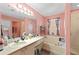 Bright bathroom featuring a tub, shower, and large vanity with ample counter space and storage at 11449 Crestlake Village Dr, Riverview, FL 33569