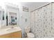 This bathroom features a turtle-themed shower curtain and light wood vanity with a white countertop at 11449 Crestlake Village Dr, Riverview, FL 33569
