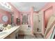 Comfortable bathroom featuring a tub, shower, and large vanity with ample counter space at 11449 Crestlake Village Dr, Riverview, FL 33569