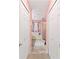 Bathroom hallway with dual closets leading to a tub and shower area at 11449 Crestlake Village Dr, Riverview, FL 33569