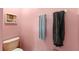 Bathroom featuring a toilet, towel racks, and pink walls at 11449 Crestlake Village Dr, Riverview, FL 33569