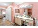 Bathroom featuring a long vanity, plenty of lighting, and an adjacent room at 11449 Crestlake Village Dr, Riverview, FL 33569