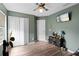 Inviting bedroom with large closet, ceiling fan, and modern flooring at 11449 Crestlake Village Dr, Riverview, FL 33569