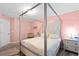 Bedroom features a four-poster bed, silver hardware, and neutral bedding for a serene escape at 11449 Crestlake Village Dr, Riverview, FL 33569