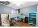 Bright bedroom features a bunk bed, desk, and ample storage in a playful and organized space at 11449 Crestlake Village Dr, Riverview, FL 33569