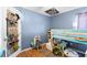 bedroom featuring a bunk bed, wood floors and shoe organizer for a functional and stylish space at 11449 Crestlake Village Dr, Riverview, FL 33569