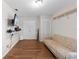 Large bonus room with updated flooring, neutral tones, and a comfortable couch at 11449 Crestlake Village Dr, Riverview, FL 33569