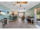 Open floor plan combines the living area with a breakfast bar, dining space and kitchen at 11449 Crestlake Village Dr, Riverview, FL 33569