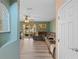 Inviting living room boasting new laminate floors, neutral paint, and sliding glass doors at 11449 Crestlake Village Dr, Riverview, FL 33569