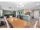 Open-concept space with dining table, seating, and partial view of the kitchen and living area, great for entertaining at 11449 Crestlake Village Dr, Riverview, FL 33569