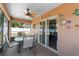 Comfortable screened-in porch with ceiling fan and turtle themed decorations at 11449 Crestlake Village Dr, Riverview, FL 33569