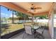 Inviting screened-in porch with ceiling fan and backyard views at 11449 Crestlake Village Dr, Riverview, FL 33569