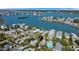 Magnificent aerial view of waterfront homes surrounded by lush landscaping and tranquil waters at 1214 Bay Shore Blvd, Indian Rocks Beach, FL 33785