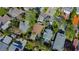 Overhead view of a home surrounded by lush greenery in a residential neighborhood at 1214 Bay Shore Blvd, Indian Rocks Beach, FL 33785