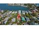 Overhead shot of waterfront property showcasing lush trees with calm waterways at 1214 Bay Shore Blvd, Indian Rocks Beach, FL 33785