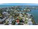 Beautiful aerial view of waterfront real estate surrounded by lush landscape and serene sea waters at 1214 Bay Shore Blvd, Indian Rocks Beach, FL 33785