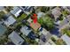 An overhead view of a home nestled amidst trees in a residential neighborhood at 1214 Bay Shore Blvd, Indian Rocks Beach, FL 33785