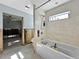 Bathroom featuring a soaking tub and shower with newly installed tile walls ready for completion at 1214 Bay Shore Blvd, Indian Rocks Beach, FL 33785