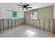 Bedroom featuring a ceiling fan and window views, needing completion and repair at 1214 Bay Shore Blvd, Indian Rocks Beach, FL 33785