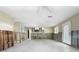 Spacious living room featuring white ceiling fan, and unfinished walls and flooring at 1214 Bay Shore Blvd, Indian Rocks Beach, FL 33785