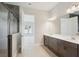 Open bathroom layout with shower and vanity, providing a spacious and convenient area to get ready at 13052 Homestead Ln, Parrish, FL 34219