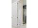 Partial view of the shower with gray tiling and the doorway leading out of the bathroom area at 13052 Homestead Ln, Parrish, FL 34219