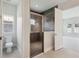 Elegant bathroom featuring a tiled shower and a toilet, offering a clean and modern aesthetic at 13052 Homestead Ln, Parrish, FL 34219