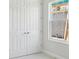 Bedroom featuring a large closet with paneled doors and a window to provide natural light at 13052 Homestead Ln, Parrish, FL 34219
