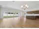 Open floor plan kitchen with a large island, modern appliances, and natural light at 13052 Homestead Ln, Parrish, FL 34219