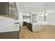 Spacious kitchen with a center island, stainless steel appliances, and hardwood floors at 13052 Homestead Ln, Parrish, FL 34219