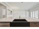 Modern kitchen boasts a large sink and expansive island, perfect for food preparation and entertaining at 13052 Homestead Ln, Parrish, FL 34219